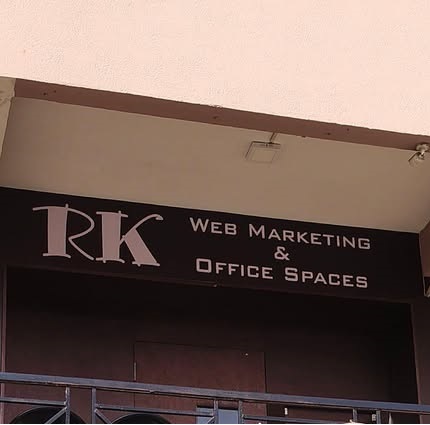 RK Office Spaces signboard at the building
